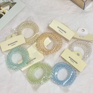 Set di elastici per capelli a spirale colori macaron su confezione