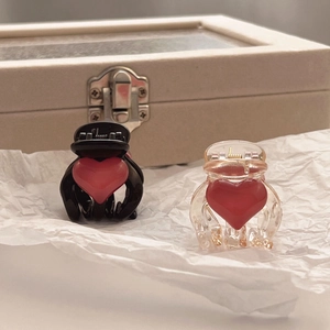 Mini heart-shaped hair claw clips set in black and amber colors for women and girls