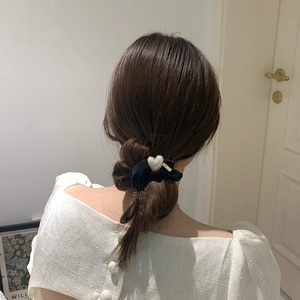 French style black scrunchie with heart pearl pendant shown on ponytail