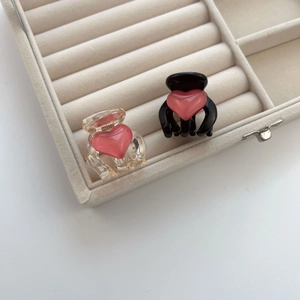 Sweet heart hair clips in black and clear resin for summer hairstyling