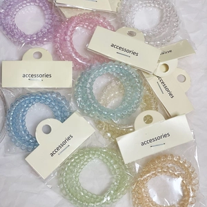 Set di due elastici a spirale colorati in tonalità macaron trasparenti