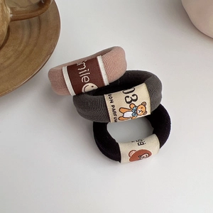 Three-piece set of bear elastic hair bands in pink, grey, and black knitted fabric