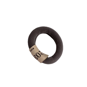 Elastic dark grey knitted hair tie with stylish beige 203 BON fabric tag detail
