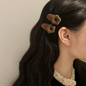 French vintage brown velvet flower hair clips for women shown on model side profile
