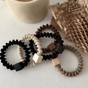 Set of 4 elastic spiral hair ties with square charms in neutral earth tones and matte finish