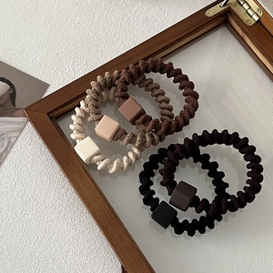 Five-piece set of spiral hair ties with matte square beads in earthy tones