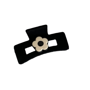 Elegant black velvet hair claw clip with a creamy white flower ornament for women