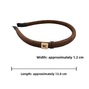 Brown knitted headband detail with dimensions showing 1.2cm width and 13.0cm length