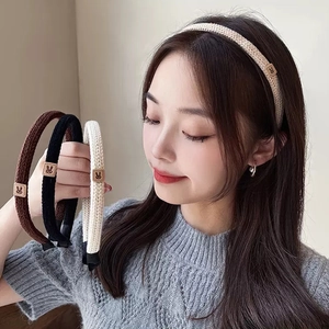 Elegant knitted headbands in brown black and cream with a cute rabbit patch detail