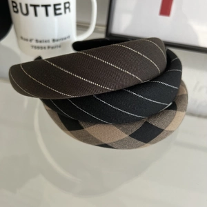 Three retro British plaid padded headbands in brown and black woven textured fabric