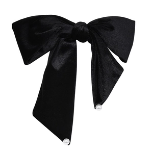 Elegant oversized black velvet bow hair clip with decorative white pearls and long ribbons