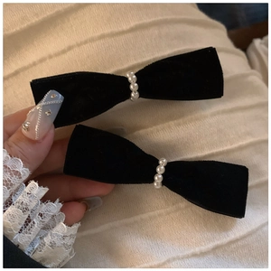 Pair of elegant black velvet bow hair clips with delicate pearl beads for women