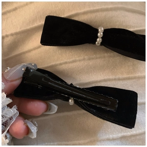 Elegant black velvet bow hair clip with white pearls and metal alligator clip