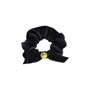 Elegant black velvet scrunchie with a stylish bow and gold button accent for hair