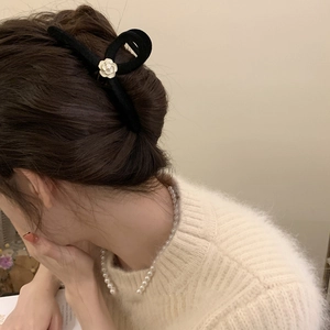 Elegant black flocked camellia hair claw clip with a white pearl accent for women