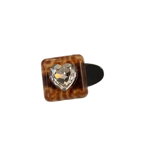 Square tortoiseshell hair clip with a large sparkling faceted crystal heart center