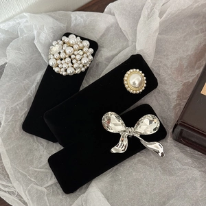 Three-piece set of black velvet hair clips with pearls, rhinestones and a silver bow