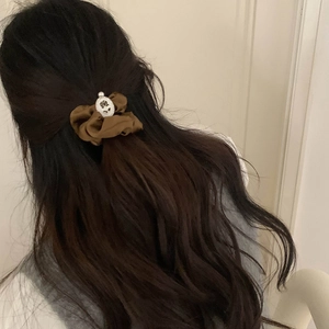 Elegant brown satin floral pearl hair tie shown on a ponytail with retro aesthetic style