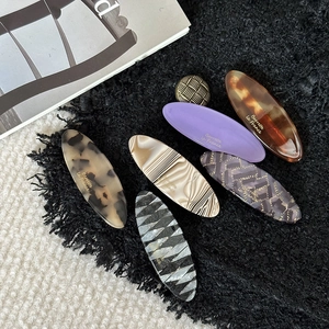 Elegant acetate oval hair clips set with tortoise shell and marble patterns in various colors