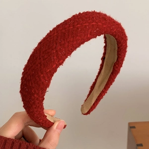 Detail of red tweed braided headband showing high-quality woven fabric and texture