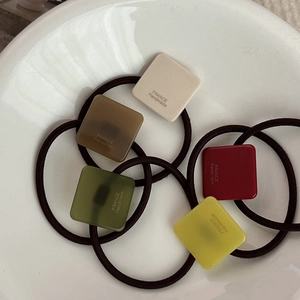 French style square gold label hair ties set in cream, burgundy, and green colors