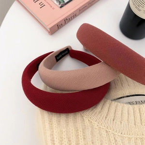 Three premium knitted sponge headbands in red and pink tones for a high-volume hair look