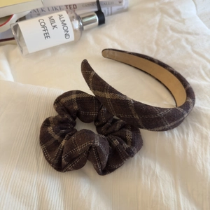 Detail of brown plaid headband and scrunchie set with vintage fabric texture
