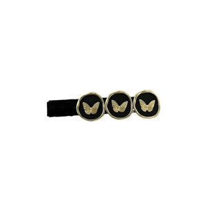 Vintage black and gold butterfly hair clip with metallic butterfly relief patterns