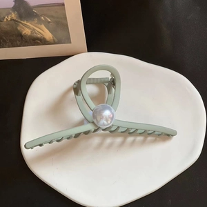 Matte grey-green large hair claw clip with elegant oversized pearl accent accessory