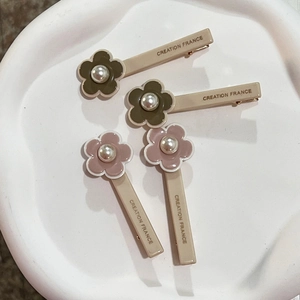 Floral hair clips with pearls and Creation France lettering in olive green and pink