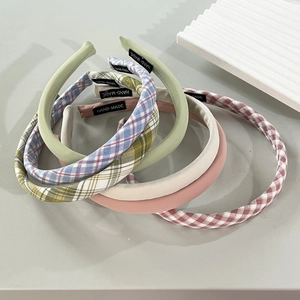 Set of handmade fabric headbands in assorted pastel colors and classic plaid patterns