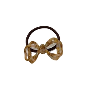 Elegant tortoiseshell patterned acetate bow hair tie with brown elastic rope for ponytails