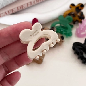 Mini rabbit claw clip hair accessory in glossy acetate finish with various colors
