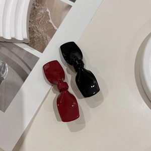 Elegante Haarklammern mit Schleife in Rot und Schwarz mit hochglänzendem Acetat-Finish