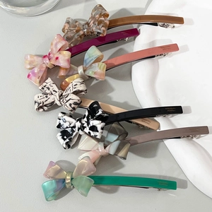 Barrettes à cheveux élégantes en acétate avec nœud, motif marbré et pince à ressort française