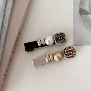 Elegant pearl and rhinestone hair clips with satin bows in French minimalist style