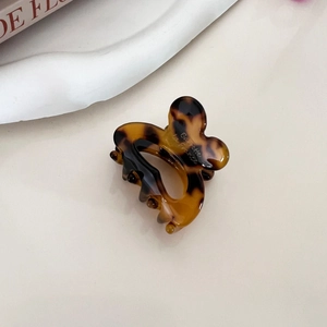 Macro detail of French style tortoiseshell hair claw clip with Barrette la France text