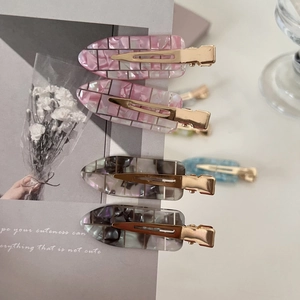 Elegant acetate seamless hair clips with marble and plaid patterns on display card