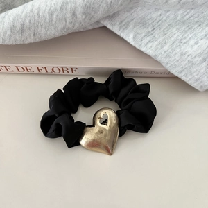 Elegant black satin scrunchie featuring a brushed gold metal heart charm for women