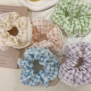 Pastel plaid scrunchies with white lace edges in yellow pink green blue and purple colors