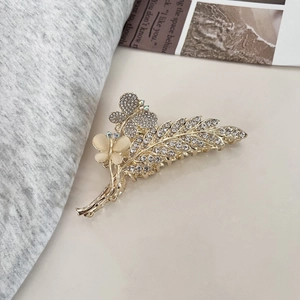 Pince à cheveux papillon dorée élégante avec opale et strass pour femmes
