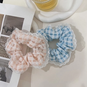 Pink and blue plaid scrunchies with white lace edges for stylish ponytail styling