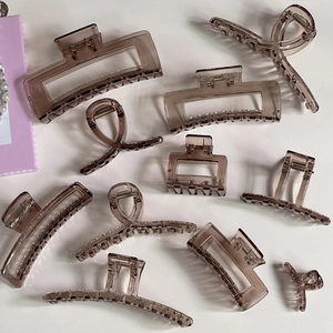 Brown translucent hair claw clip set with various geometric shapes for elegant styling