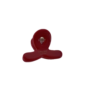 Mini red acetate hair claw clip with glossy finish and gold stamp for women