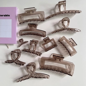 Set of 10 coffee brown translucent acrylic hair clips in various geometric shapes