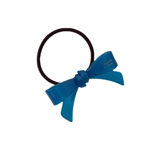Translucent blue acetate bow hair tie with golden logo on durable brown elastic cord