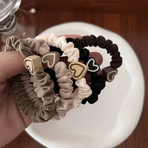Five-piece heart elastic scrunchie set in earth tones including cream and brown colors