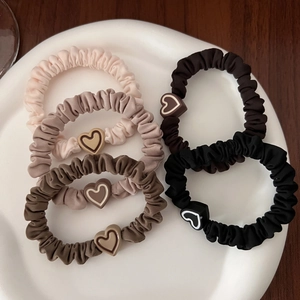 Set of 5 minimalist heart scrunchies in neutral colors like cream, brown, and black