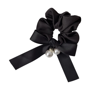 Elegant black satin bow scrunchie with white pearls and a golden metal pendant charm
