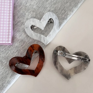 Three-piece heart-shaped acetate hair clips set with marble and tortoiseshell patterns
